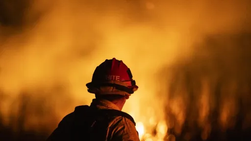 A firefighter monitors the spread of the Auto Fire in Oxnard, North West of Los Angeles, California, on January 13, 2025